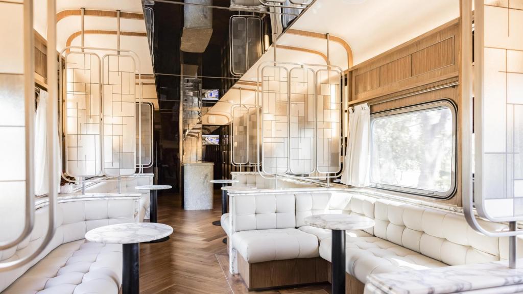 Platinum Club lounge with curved upholstered seating and windows.